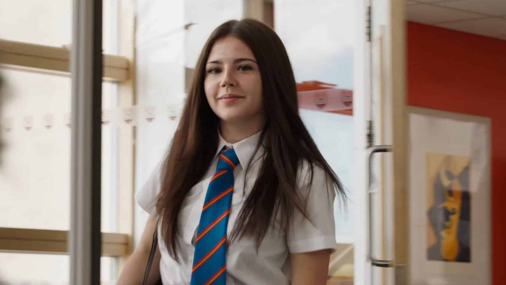 School pupil walking into classroom